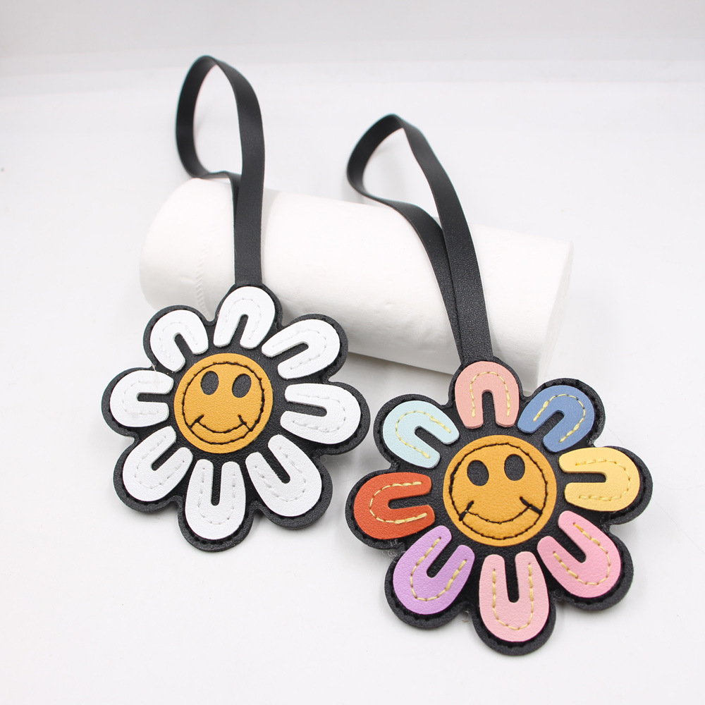 1個のひまわりの楽しい顔の花のキーホルダー、フェイクレザーの - Phone Accessories Ideas のレビューと価格