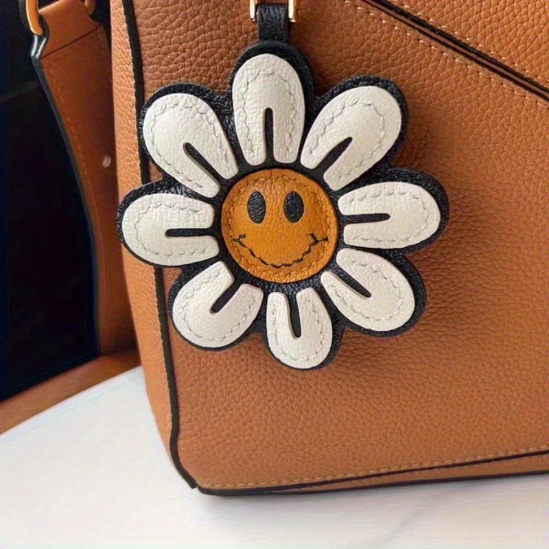 1個のひまわりの楽しい顔の花のキーホルダー、フェイクレザーの - Phone Accessories Ideas のレビューと価格